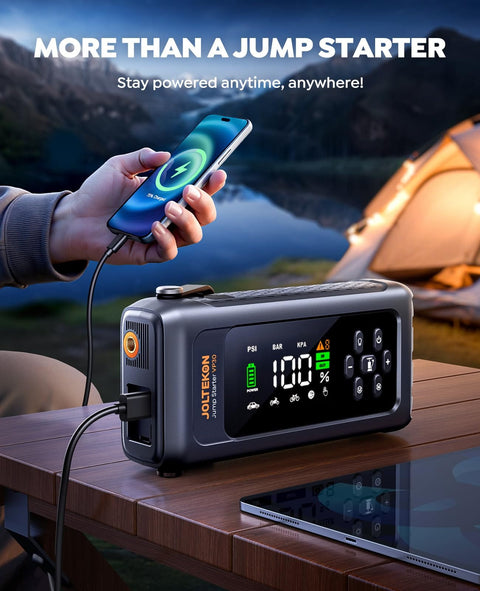 8-In-1 Car Jump Starter With Air Compressor And Tire Inflator, 4500A Peak on a table charging a smartphone