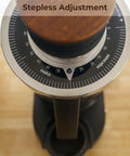 Top Shelf Single Dose Coffee Grinder Equipped With 83Mm Red Titanium Flat Burrs And Integrated Plasma Ionizer Chute For Zero Static Clumps Ideal For Home Brew Crews Chasing Consistent Pulls Without Any Headache In Classic Black with stepless adjustment dial.