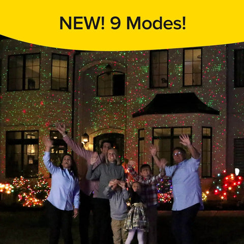 Family under Ultra 9 Outdoor Laser Light Projector With 9 Enhanced Modes delivers thousands of green lights on house exterior.