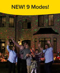 People in front of a house with Outdoor Holiday Laser Light Projector Set Of 2, thousands of bright dots, showcasing 9 enhanced modes.