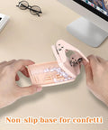 Person using Pink Two Hole Punch With Ruler One Quarter Inch Punch For File Folders And Looseleaf Metal Manual Low Force Double Punch