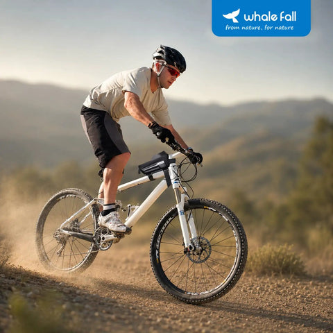Cyclist using Waterproof Bike Frame Bag With 3D EVA Hard Shell And Sealed Zipper Top Tube Phone Holder Pouch For Cyclists Rain Cover Included Durable Bike Accessory For Phones Under 7 Inches Keeps Gear Dry In Rain Or Mud on mountain trail.