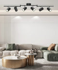 Six Light Black Track Lighting Kit With Adjustable LED Heads And GU10 Sockets in modern living room with sleek decor