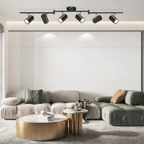 Six Light Black Track Lighting Kit With Adjustable LED Heads And GU10 Sockets in modern living room with sleek decor