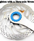 Centerlock Lockring For 12mm, 15mm, And 20mm Thru Axles And Quick Release on disc rotor with wrench shown