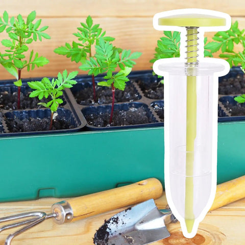 Go To Seed Spreader And Sowing Tool For Gardeners with ergonomic design, shown beside young seedlings and garden tools in a tray.