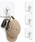 Heavy Duty Adhesive Hooks With 360 Degree Swivel Nail Free Wall Ceiling Mount Rotating Rack For Bathroom Kitchen Decor Tools No Drilling Peel Stick High Capacity Strong Support holding keys and a hat.