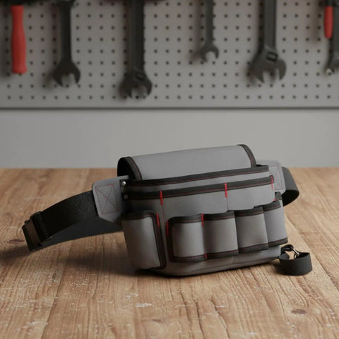 Rig Ready Waterproof Oxford Canvas Tool Belt Waist Pack With Slick Adjustable Strap And Killer Storage Loops Hella Comfortable For Electricians Crushing It On Site, gray tool belt with pockets on wooden surface.