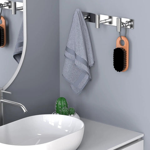 Stainless Steel Wall Mount Coat Hooks Set With Three T Shaped Hooks For Coats Bags Towels And Accessories Heavy Duty Rust Proof Wall Hanger Easy To Install Silver Finish mounted in bathroom with towel and brush hanging.