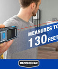 Snappy Precision Digital Laser Tape Measure 130Ft Range held against a wall for accurate measurements in a home setting.