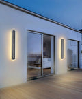 Dope Outdoor Wall Light LED 42W 3000K 35 Inch Long Black Metal Waterproof Modern Exterior Lighting Fixture illuminated on patio wall