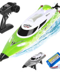 High Speed Remote Control Boat For Adults And Kids Aged Eight To Thirteen 35 Plus KPH With 180 Degree Flip Auto Righting shown with remote and battery