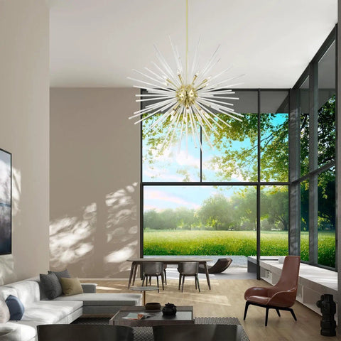 Straight Up 16 Light Satin Brass Foyer Pendant Chandelier With Real Clear Crystal Rods in modern living room with large windows.