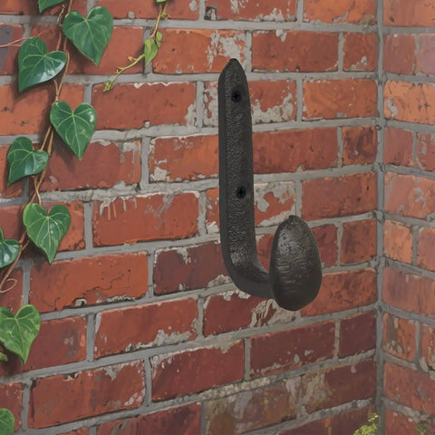 Four Pack Badass Cast Iron Wall Hooks In Rustic Black Vintage Coat Rack Heavy Duty Entryway Storage Organizer With Pre Drilled Screws For Jackets Bags And Everyday Gear on brick wall