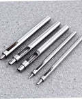 Heavy Duty Leather Belt Hole Punch Tool Set For DIY Projects And Falconry Crafts, metal punch heads on gray surface