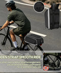 Cyclist using Expandable Waterproof Bike Trunk Bag 15L To 23L For Rear Rack 4 In 1 Pannier Saddle Bag with rain cover on a black bike