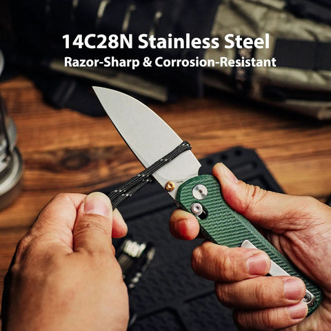 Rockshark EDC Folding Pocket Knife With 3.03 Inch 14C28N Drop Point Blade Green Micarta Handle in hand on wood table