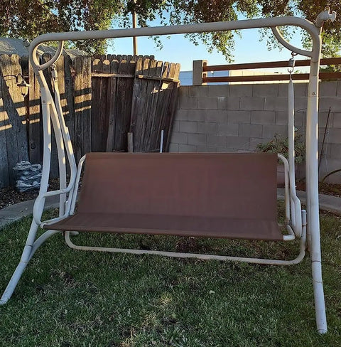 Outdoor 3-seater swing with brown cover on frame, illustrating replacement use for Heavy Duty 600D Patio Swing Seat Cover.