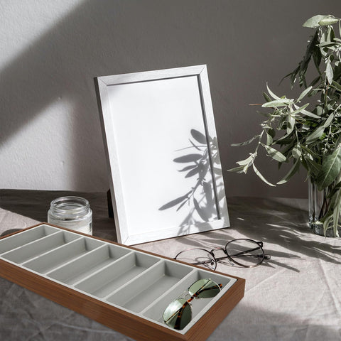 Slick Wooden Sunglasses Display Tray With Soft Gray Velvet Lining Seven Grid Eyewear Organizing Rack with sunglasses on desk.