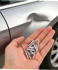 Hand holding silver 4mm metal pulling pins from Top Picks For Car Body Repair Welding Studs 50 Pack for dent removal.