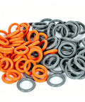 Orange And Grey Quick Disconnect O Ring Set For One Quarter And Three Eighths Inch Pressure Washer Couplers 50 Pack Twenty Five Plus Twenty Five High Temperature O Rings For Up To Two Hundred Twelve Degrees Fahrenheit in pile, orange and gray rings displayed.