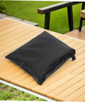 Built Tough Heavy Duty Patio Umbrella Cover with Zipper on wood deck highlighting weatherproof polyester fabric.