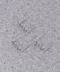 Three silver steel welding rods laid on a gray surface for the Top Pick 1000 Pcs Car Bumper Repair Rods Welding Wire Steel Silver Stapler Fix Kit For Plastic Abs Pvc Nylon Auto Body Work Super Easy Deal.