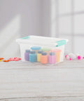 Sixteen Pack Clip Boxes Stackable Clear Plastic Storage Bins With Latching Lids show craft supplies inside on a wooden surface