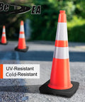 Eight 28 Inch Orange PVC Traffic Cones With Black Base standing on pavement, emphasizing durability and weather resistance.