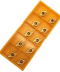 Ten DCMT21.51/DCMT070204 coated carbide turning inserts in a yellow 10-pocket organizer tray
