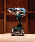 High Performance 18v Cordless Drill Driver Boasting 70 Nm Top Shelf Torque And Xpt Weather Resistant Shielding, shown on wood surface.