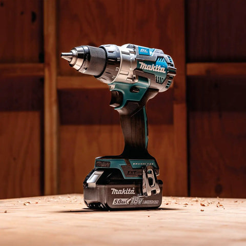 High Performance 18v Cordless Drill Driver Boasting 70 Nm Top Shelf Torque And Xpt Weather Resistant Shielding, shown on wood surface.