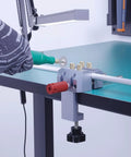 Close-up of Dope Little Aluminum Table Vise For Crafts And Jewelry Making 2.8 Inch Portable Mini Bench Clamp in use on a table.