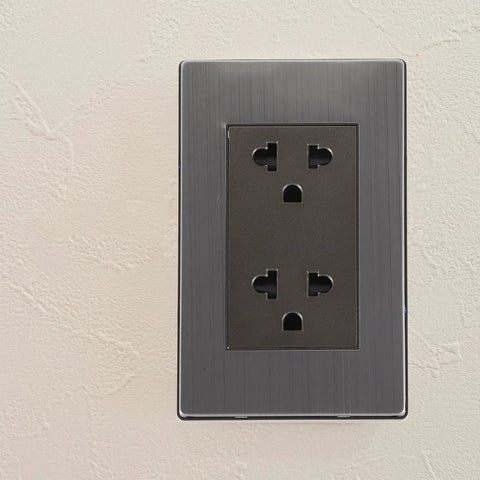 Heavy Duty Stainless Steel Wall Outlet Extender Plate With Circular SixSocket Configuration And Smart Usb ChargingPorts ForHome&OfficePowermanagement&ClutterFreeDecor on light textured wall.