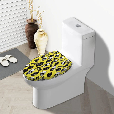 Elongated Toilet Seat for Bathroom in yellow with skull designs, fitting a standard elongated toilet bowl.