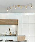 Payton 6-Light Foldable Track Lighting In Painted Brass With Exposed Sockets installed in modern kitchen ceiling