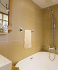 Bathroom with beige tiles featuring No Drilling Suction Cup Towel Bar 16 Inches Heavy Duty Wall Mount Towel Holder beside bathtub
