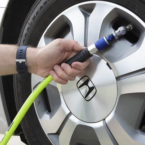 Using Blue 14 Piece Automotive Type C Coupler and Plug Kit With One Quarter Inch NPT Fittings on car tire for pro grade pneumatic work