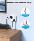 Wall-mountable power strip installed above desk, showing two mounting holes and three screws, part of All In One Surge Protector Power Strip With USB Ports 10ft Flat Plug Extension Cord Eight In One Charging Station Four AC Outlets Three USB A And One USB C Wall Mount Must Have For Home Office And Dorm Room Setups.