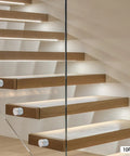 10 Pack 304 Stainless Steel Glass Railing Standoffs With Slick Wire Draw Texture, installed on modern wood stairs.