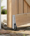 Heavy Duty Gate Caster Wheels With Rubber Pulley Track Rollers For Sinking Wood Fences And Garden Doors Galvanized Steel Bracket close-up on gate.
