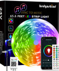 Smart RGB Led Strip Lights For Bedroom 100 Ft With Music Sync Remote 40 Key WiFi And Bluetooth Control Alexa And Google Home Compatible Colorful Ambience For A Lit Bedroom Vibe Easy Setup Wireless Mood Lighting in packaging with smartphone and remote control.