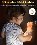 Child holding Adorable Cat Shaped Night Light For Kids Who Love Cozy Vibes Silicone USB Rechargeable Multicolor LED Lamp