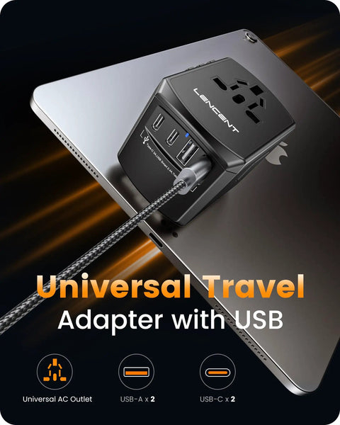 Universal Travel Power Adapter With 2 USB C Ports And 2 USB A Ports Worldwide Wall Charger resting on tablet