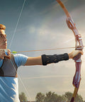 Archer wearing Adjustable Archery Arm Guard Bracer For Unisex Archers Lightweight Forearm Protector during target practice.