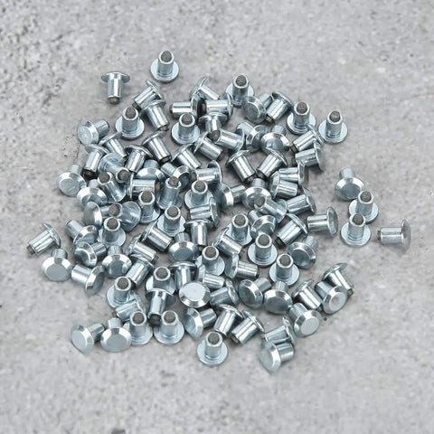 Heavy Duty Non Slip Tire Studs For Cars Trucks Atvs And Motorcycles With Built Different Tungsten Steel Core For Ice Snow And Mud Traction 100 Piece Pack Road Grip scattered on a gray surface
