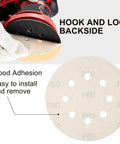 110 Piece 5 Inch 8 Hole Sanding Disc Set With Aluminum Oxide Grits 60 Showing Hook and Loop Backside for Easy Installation
