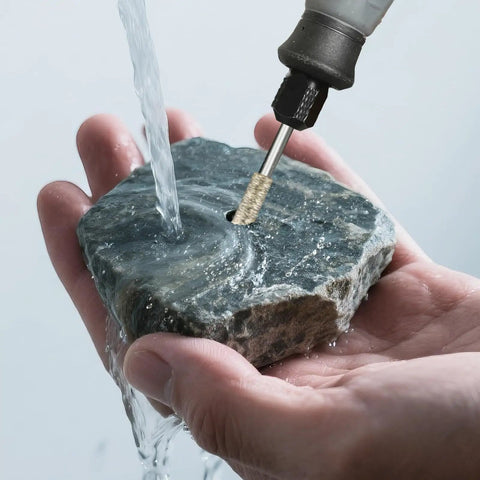 Using 24-Piece Diamond Grinding Bit Set For Rotary Tools With One Eighth Inch Shank, Includes 60 And 150 Grit Polishing Burrs on stone