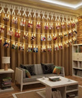 40 LED Photo Clip String Lights With Remote USB Powered 25.75 Ft Long 8 Modes displaying photos in cozy living room