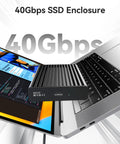 Blazing Fast 40Gbps NVMe M2 SSD Enclosure Handles Up To 8TB beside a laptop, showcasing aluminum casing and USB-C connection.